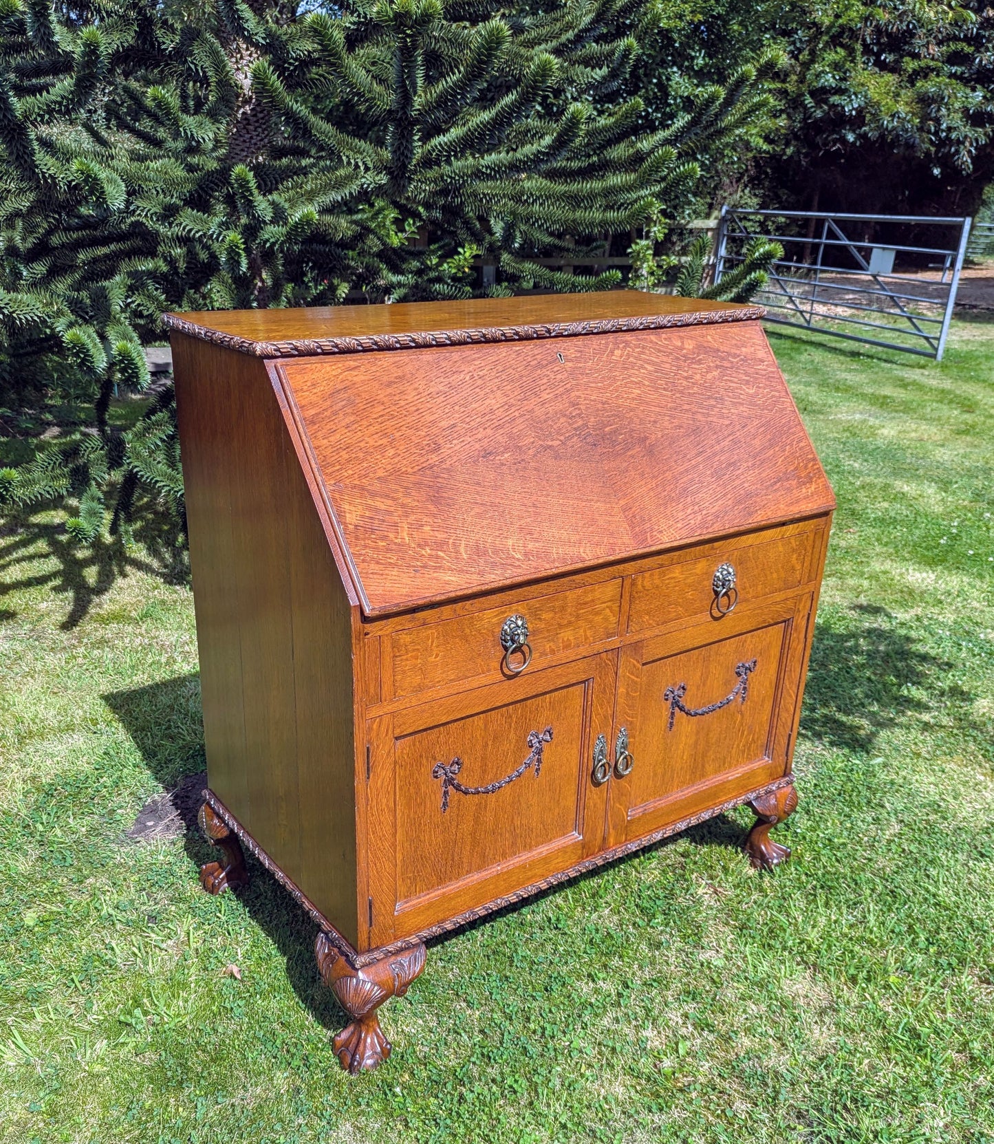 Antique early 20th century ball and claw feet bureau including secret compartment