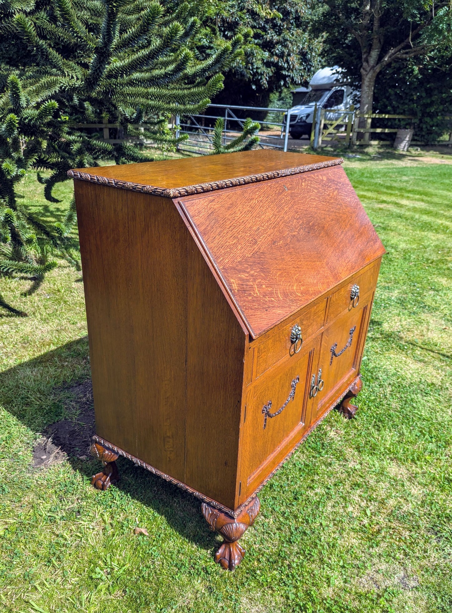 Antique early 20th century ball and claw feet bureau including secret compartment