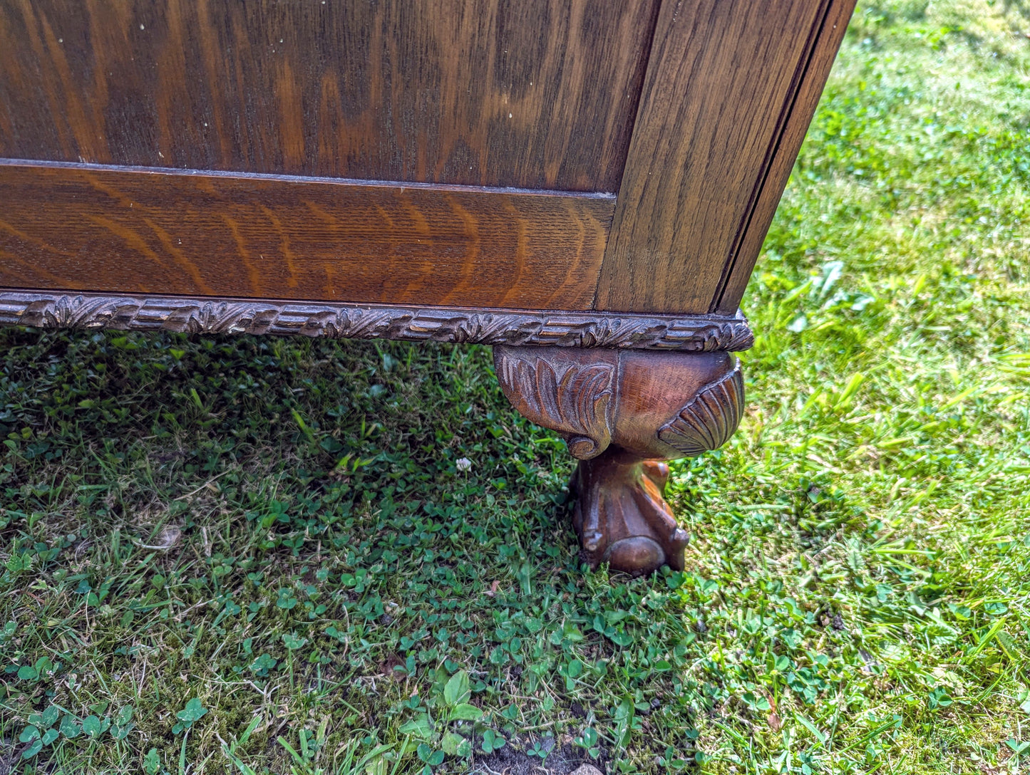 Antique early 20th century ball and claw feet bureau including secret compartment