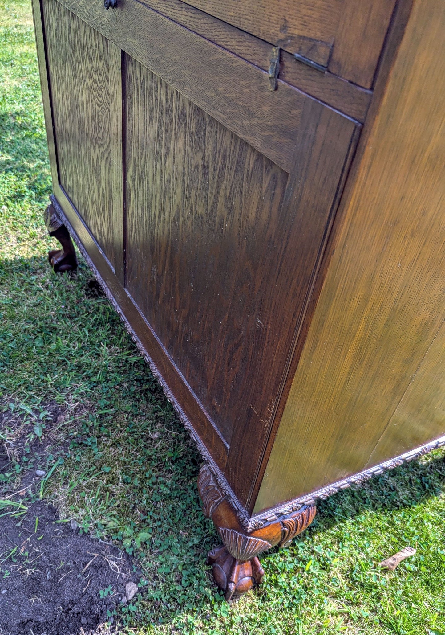 Antique early 20th century ball and claw feet bureau including secret compartment