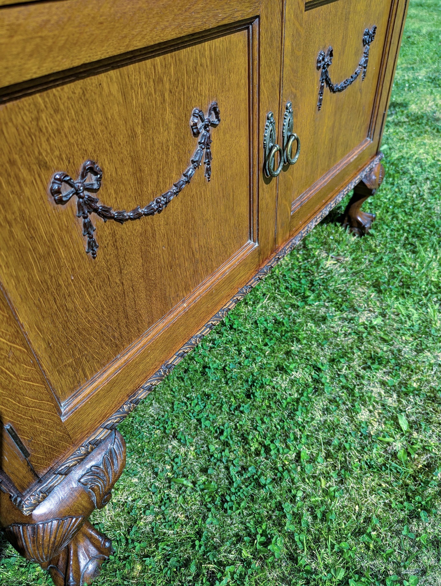 Antique early 20th century ball and claw feet bureau including secret compartment