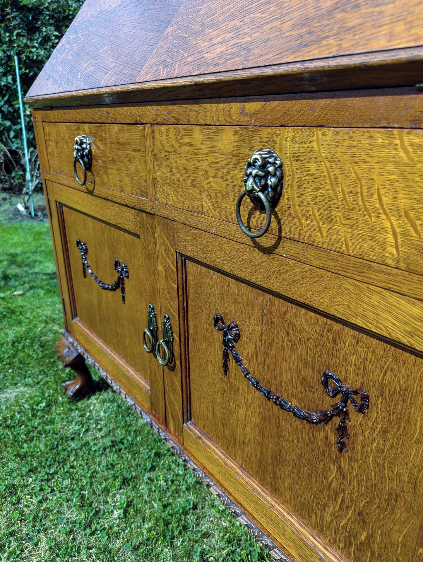 Antique early 20th century ball and claw feet bureau including secret compartment