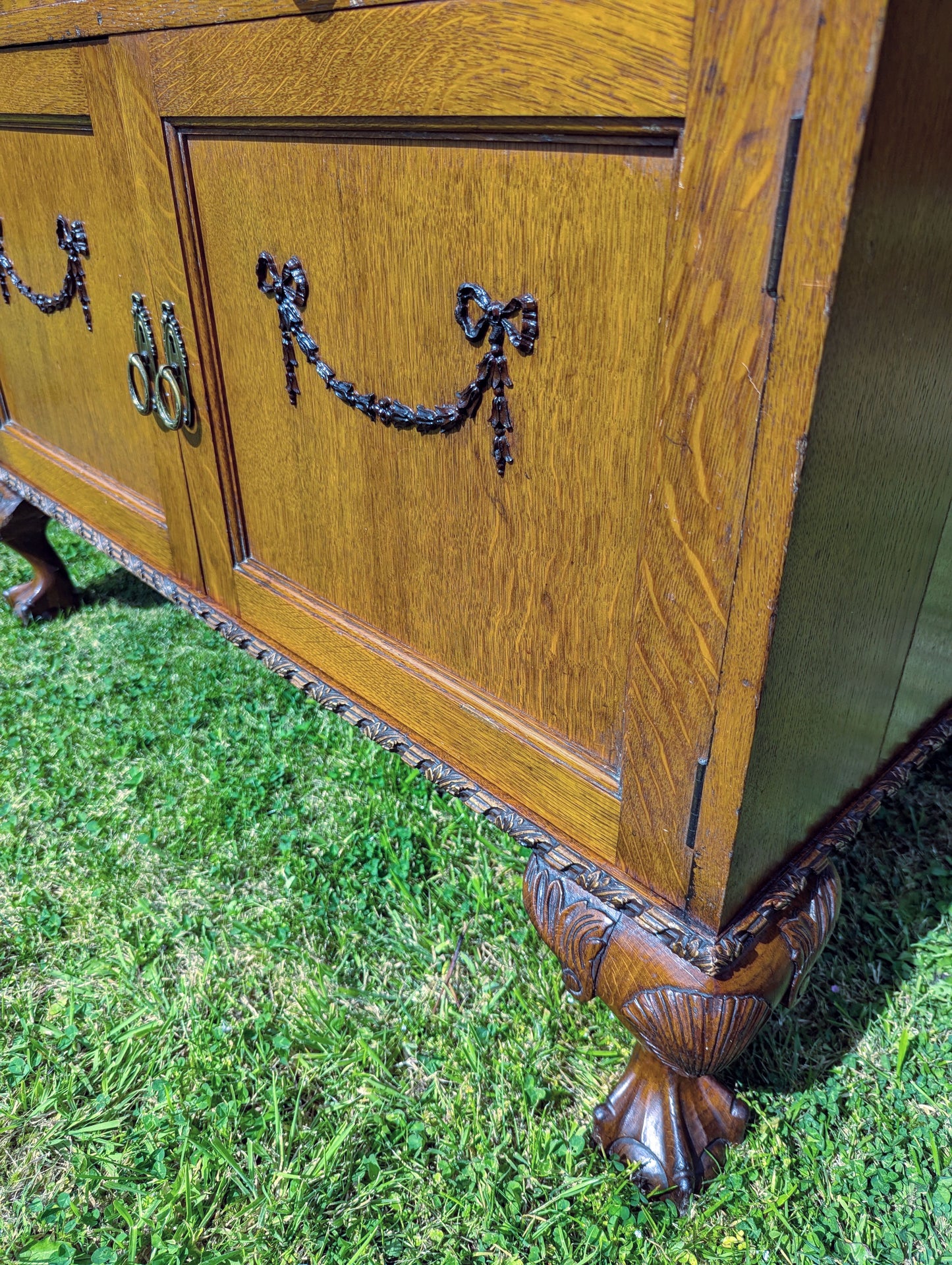 Antique early 20th century ball and claw feet bureau including secret compartment