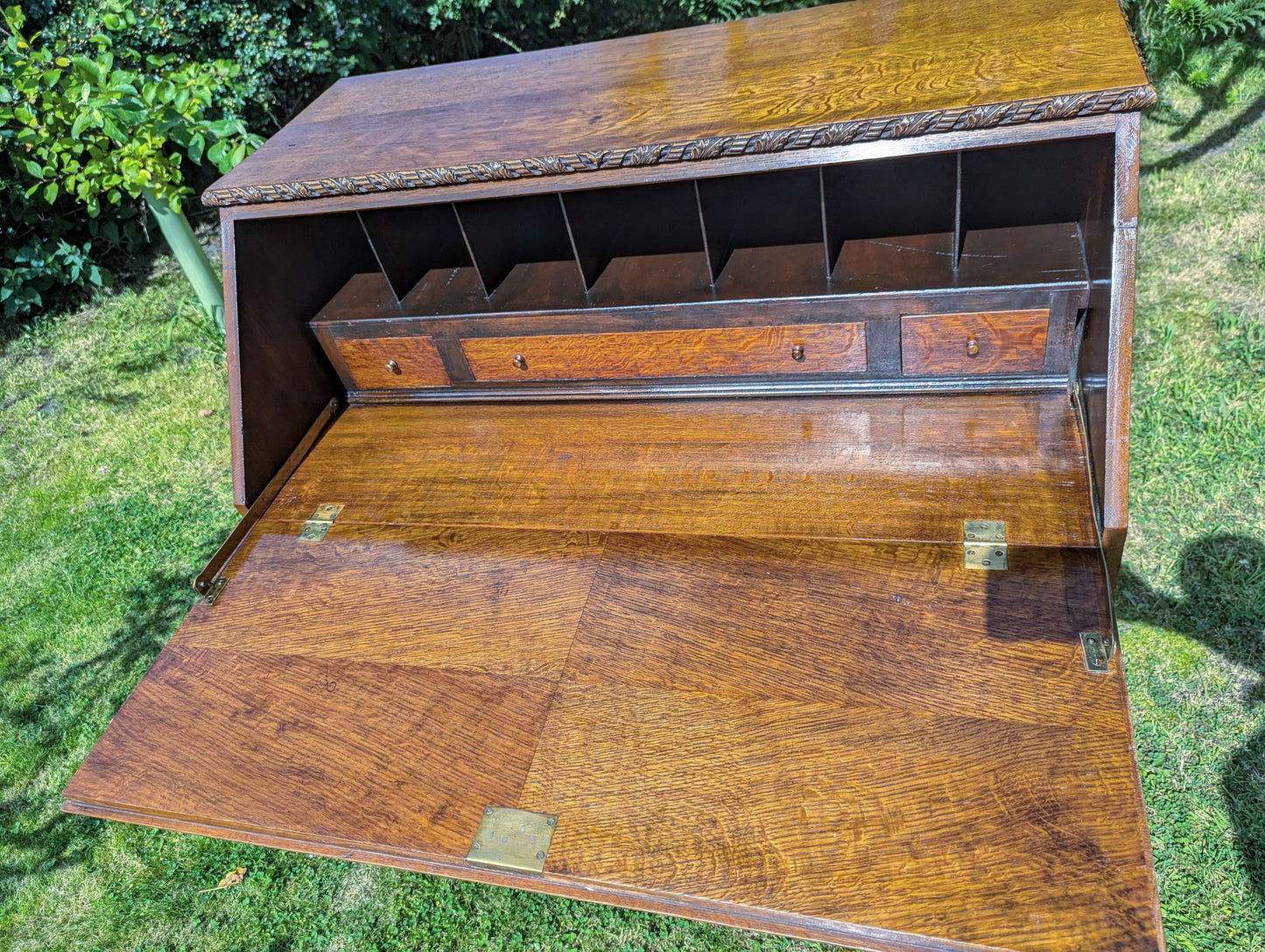 Antique early 20th century ball and claw feet bureau including secret compartment