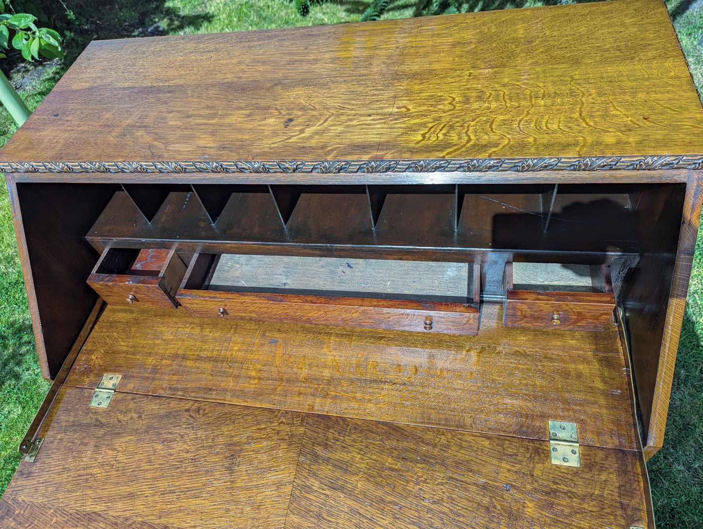 Antique early 20th century ball and claw feet bureau including secret compartment