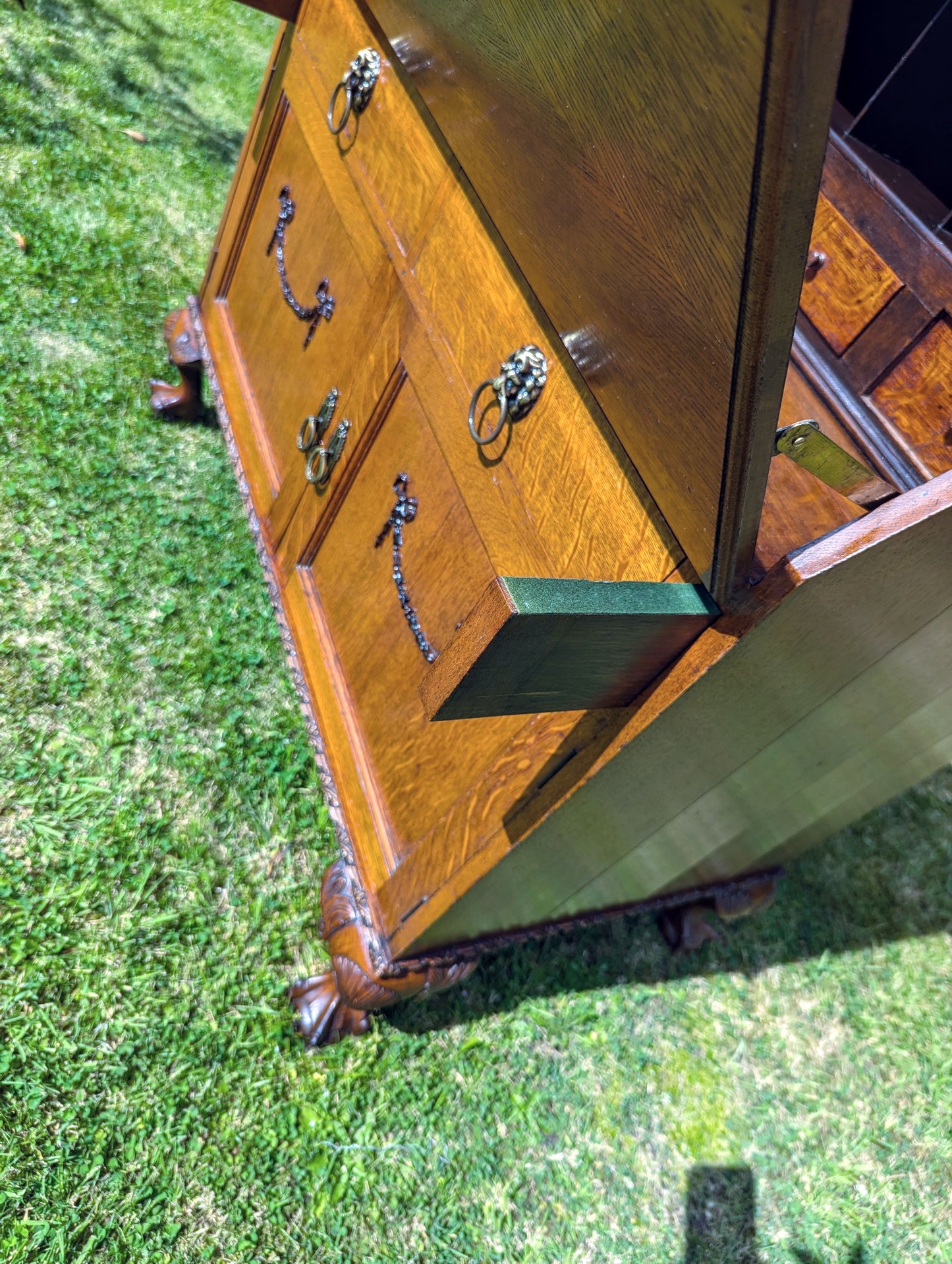 Antique early 20th century ball and claw feet bureau including secret compartment