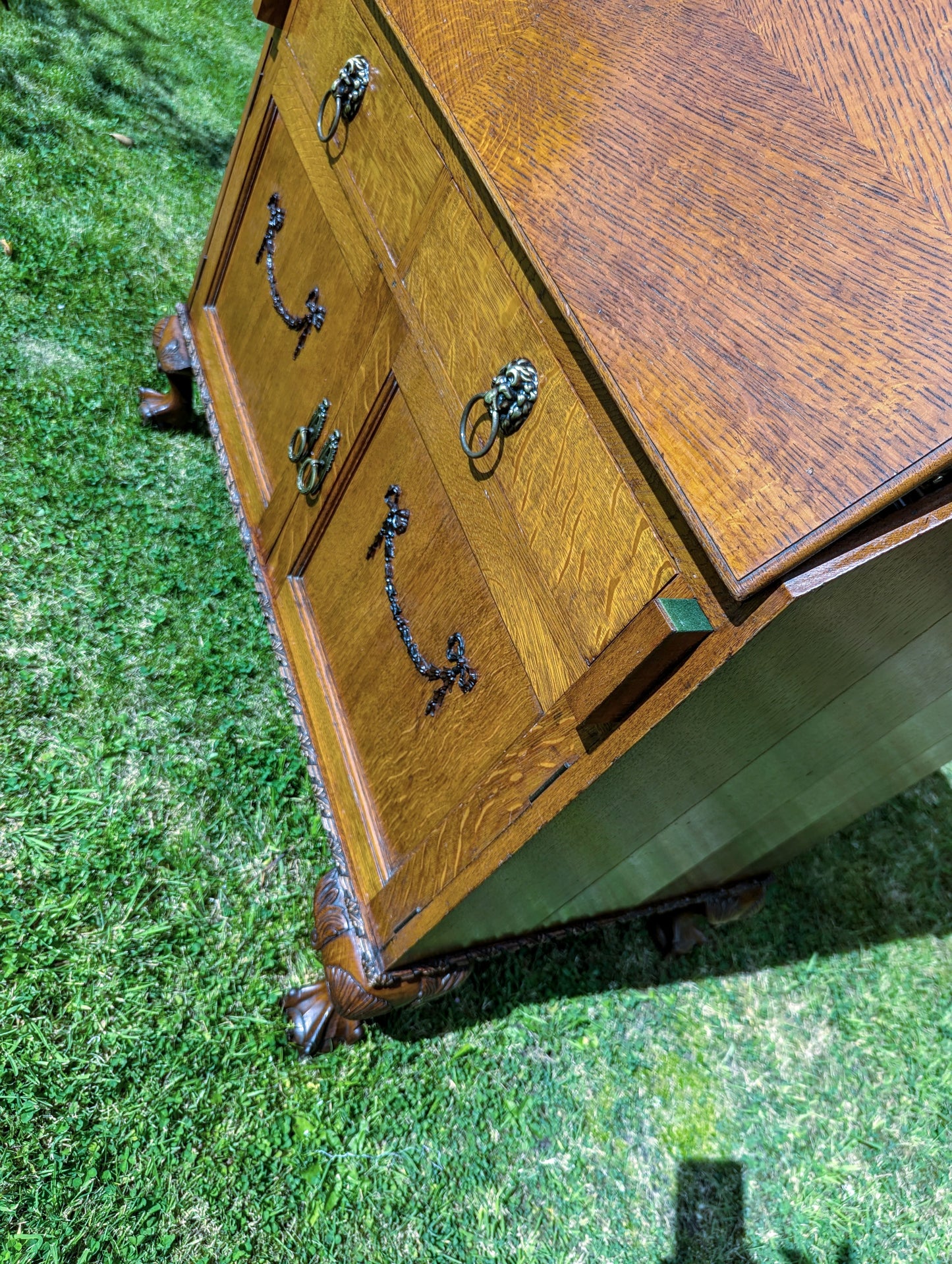 Antique early 20th century ball and claw feet bureau including secret compartment