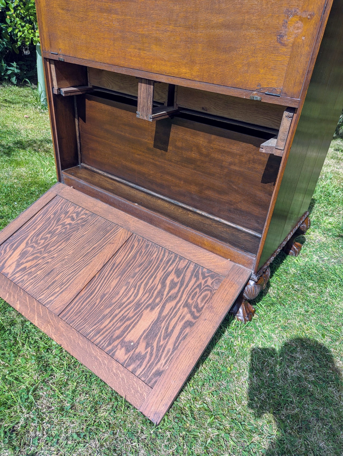 Antique early 20th century ball and claw feet bureau including secret compartment