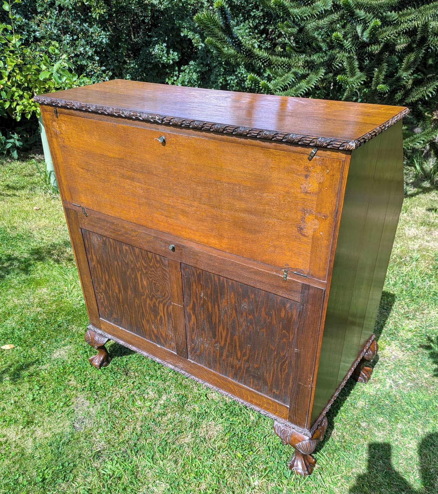 Antique early 20th century ball and claw feet bureau including secret compartment